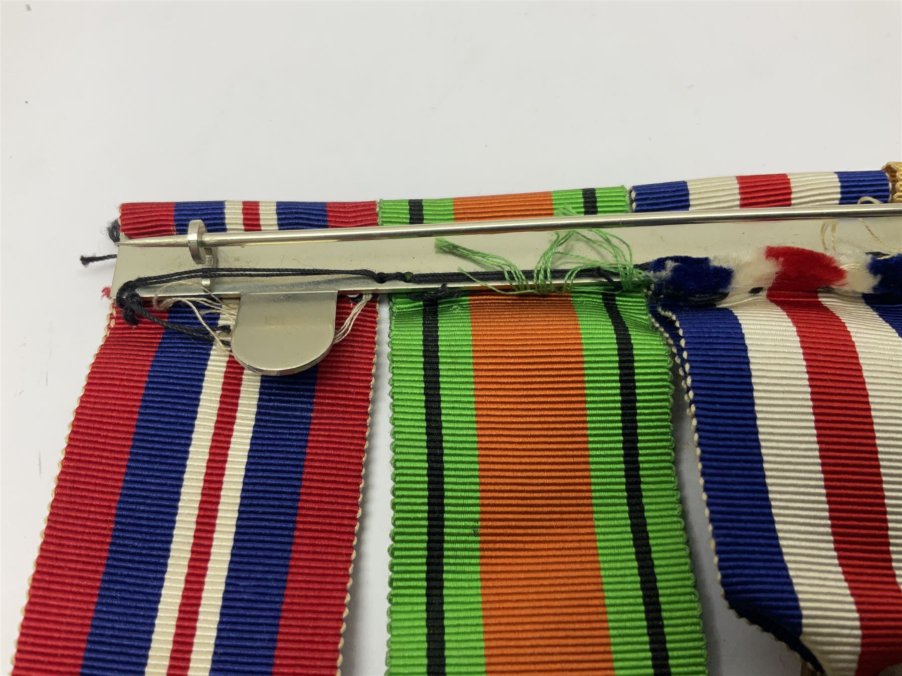 WWII group of five medals comprising 1939-45 War Medal, Defence Medal, 1939-45 Star, Africa Star and France and Germany Star on wearing bar; WWI British War Medal awarded to 142019 Pte. A. Thompson A.S.C.; and boxed King's Badge 'For Loyal Service'