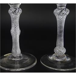 18th century ale glass, the funnel bowl raised upon a single series air twist double knopped stem and conical foot, H20cm, together with a similar smaller drinking glass, H15.5cm