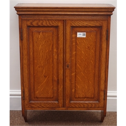  Early 20th century oak wall cupboard, two panelled doors enclosing two shelves, W44cm, H62cm  