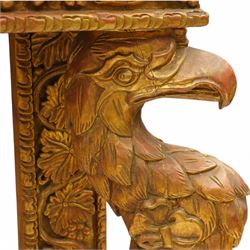 Pair of carved giltwood and composition console or pier tables, rectangular variegated rouge marble top, the frieze decorated with trailing vine and grape bunches, eagle front supports on stepped rectangular base