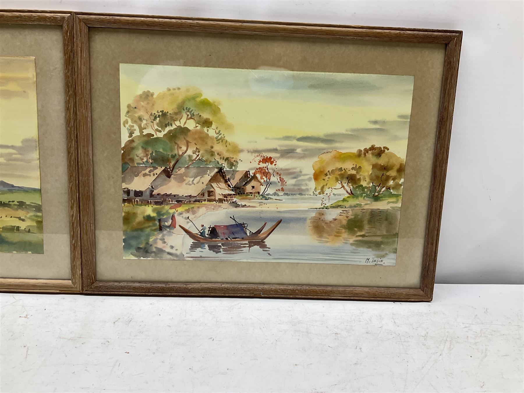 M Thein Pe (Burmese 20th Century): 'Sunset - Paddy Lands Burma' and 'Burmese Villages', pair watercolour sketches signed, labelled verso 19cm x 28cm (2)
