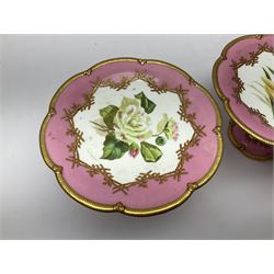 Victorian dessert service, comprising four comports and nine plates, each decorated with floral sprigs to the centre with a pink and gilt border, largest comport H13cm, plate D22.5cm