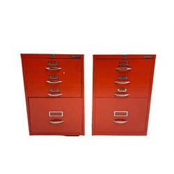 Two red finish 'Bisley' four drawer filing cabinet

