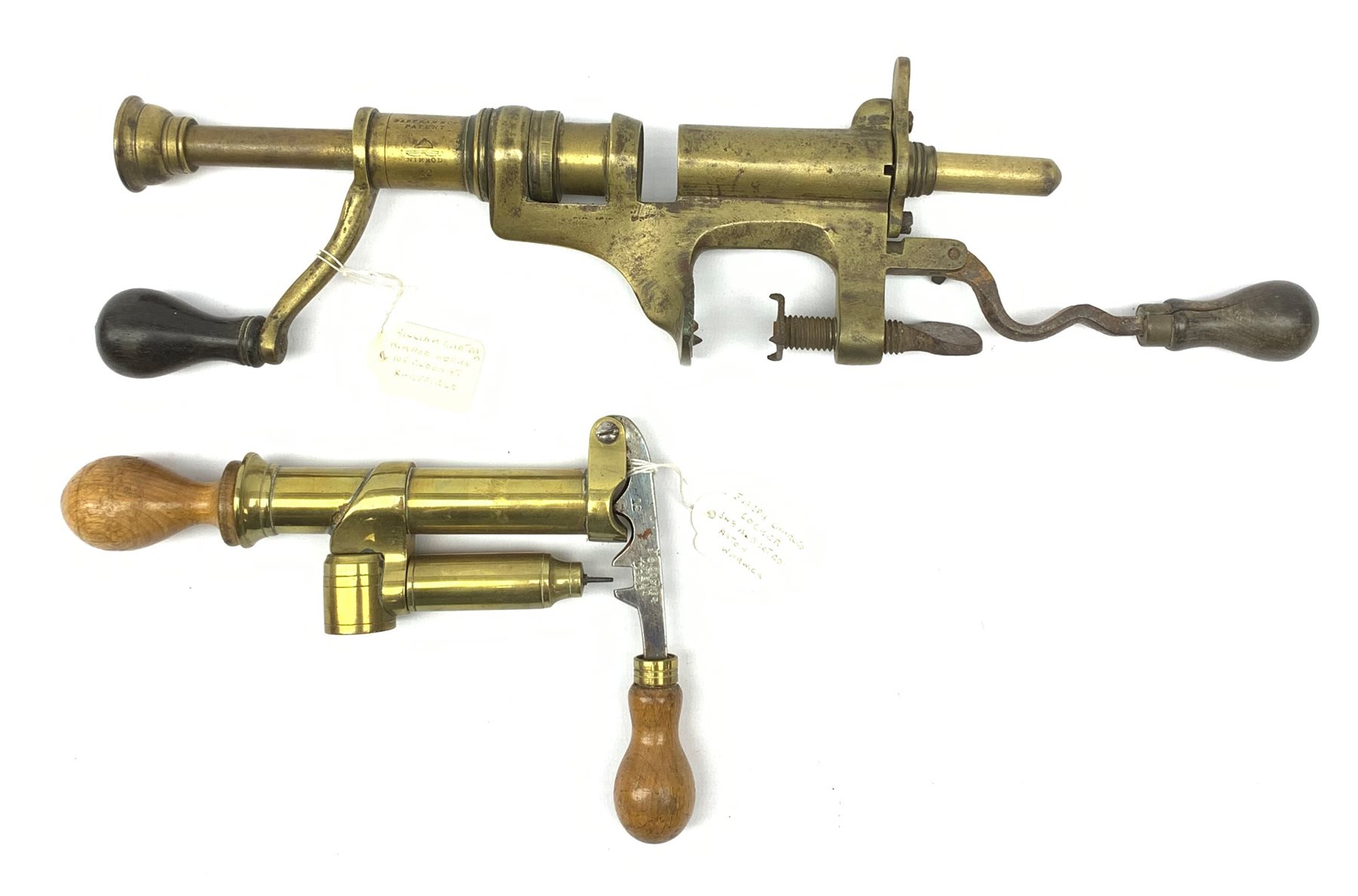 Two 19th century brass 12-bore cartridge making tools comprising bench mounting Bartram & Co Patent 'Nimrod' re-loader and J.C. Cocker Patent 5535 redecapper with turned wooden rammer (2)