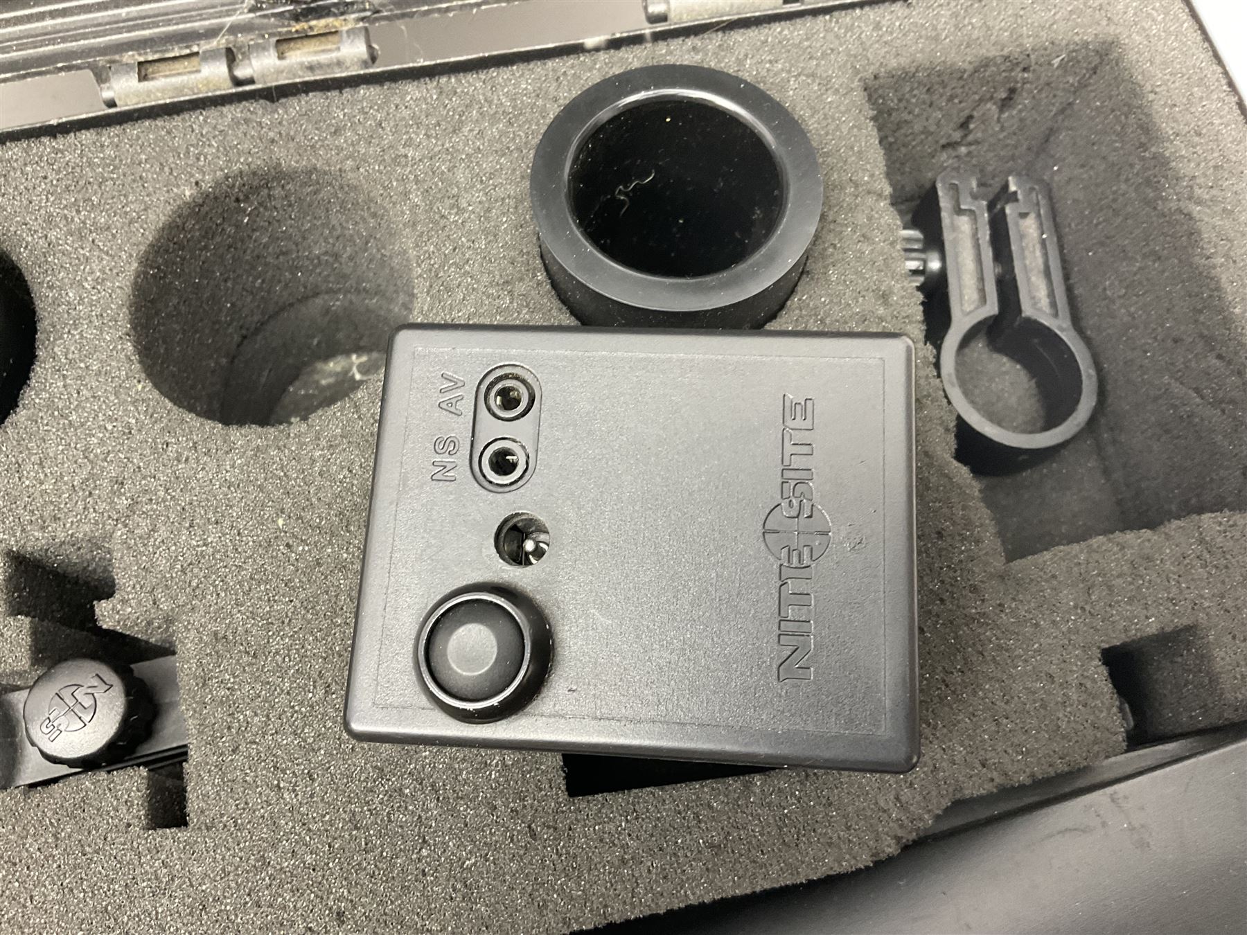 Two Nite-Site add-on kits in hard plastic carrying cases; one with charger