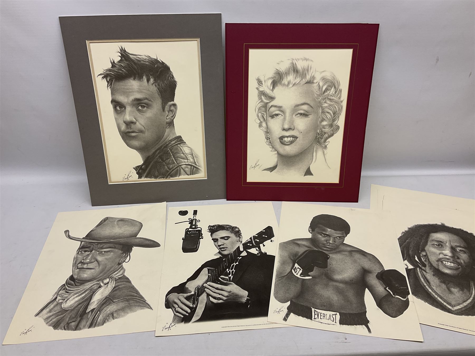 After Chris Burns, twenty-one unframed monochrome prints of pop, film and sports stars including The Beatles, John Lennon, Jimi Hendrix, Madonna, Marilyn Monroe, John Wayne, Bruce Lee, Audrey Hepburn, David Beckham, Manchester United etc. 29.5 x 42cm; some card mounted; and 1935 Silver Jubilee Daily Mail newspaper