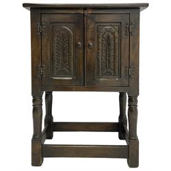 Small oak hutch cupboard, fitted with two carved doors