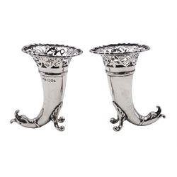Pair of small Edwardian silver cornucopia vases, of trumpet form with flared and pierced rims, supported upon shell scroll feet and dolphin tails, hallmarked Goldsmiths & Silversmiths Co Ltd, London 1903, H8cm, 3.35 ozt (104.1 grams)