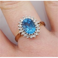 9ct gold diamond and oval blue topaz cluster ring, hallmarked