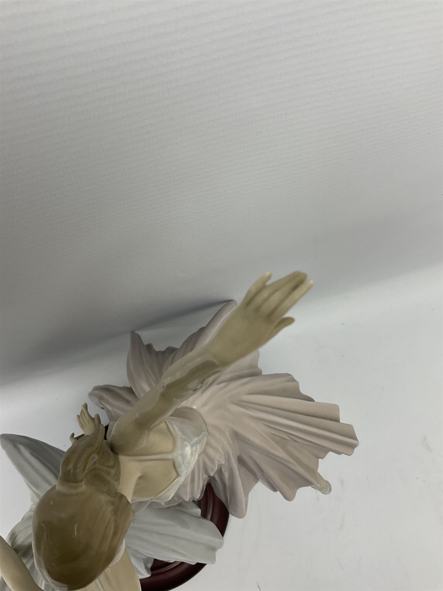 Lladro figure group, 'Merry Ballet', modelled as two ballerinas in dancing pose, raised on a turned socle base, no. 5035, printed marks beneath, H49cm