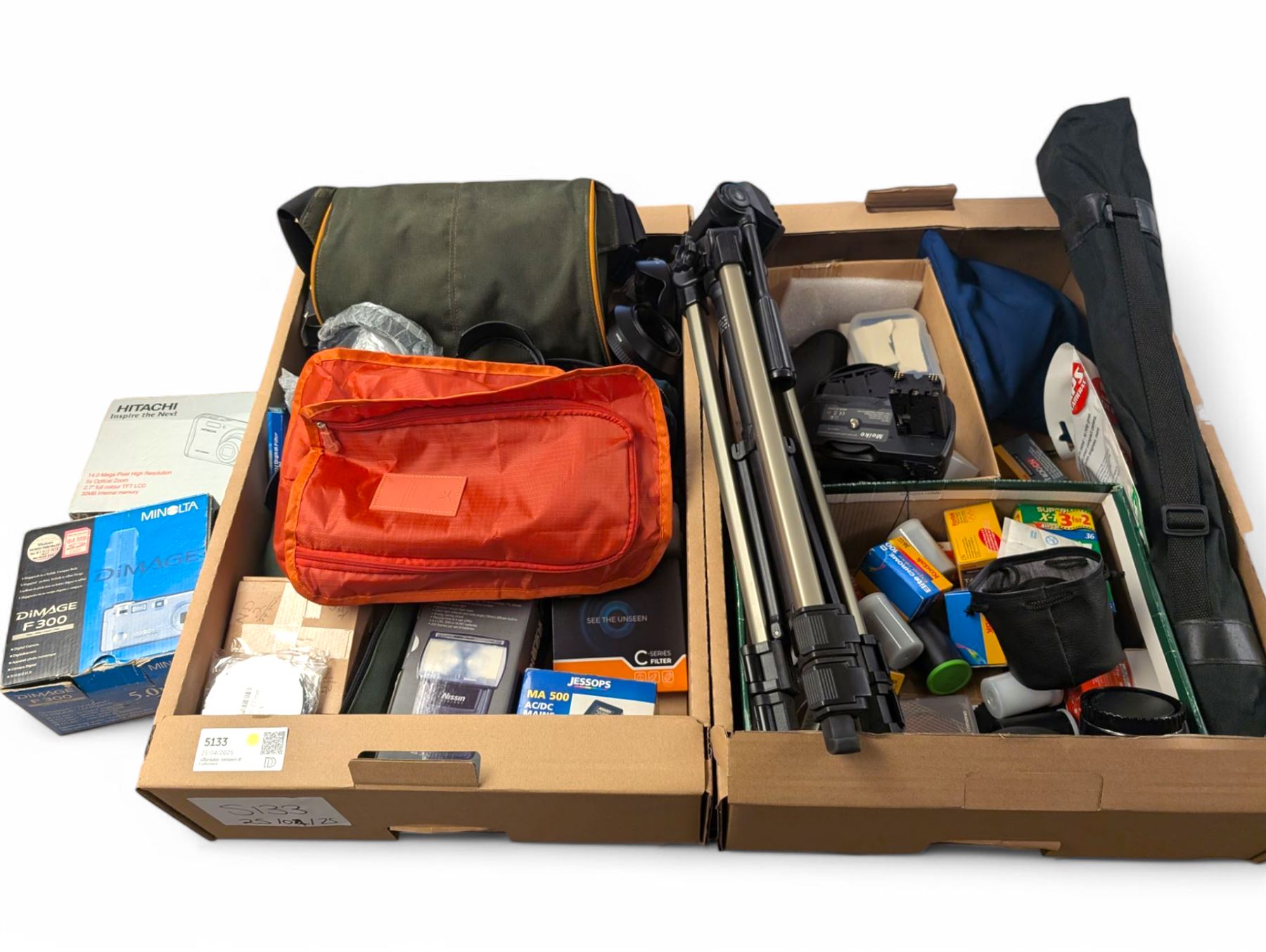 Minolta Dimage F300 digital camera and a Hitachi HDC-1499 digital camera, both boxed, together with a collection of camera accessories including filters, straps and cases 