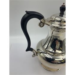 1920s five-piece silver tea service, comprising teapot, coffee pot, hot water pot, twin handled open sucrier and milk jug, each of squat circular form with shaped rim, the teapot, coffee pot and hot water pot each with ebonised handle and finial, the sucrier and milk jug with acanthus capped scroll handles, all upon circular foot, hallmarked R F Mosley & Co, Sheffield 1926 & 1927, tallest H24cm