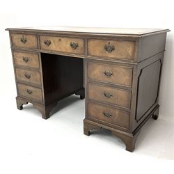 Late 20th century mahogany twin pedestal desk, rectangular moulded top with leather inset, fitted with nine drawers above bracket supports