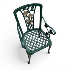 Cast aluminium oval garden table and set of four armchairs with pierced rose design back splats