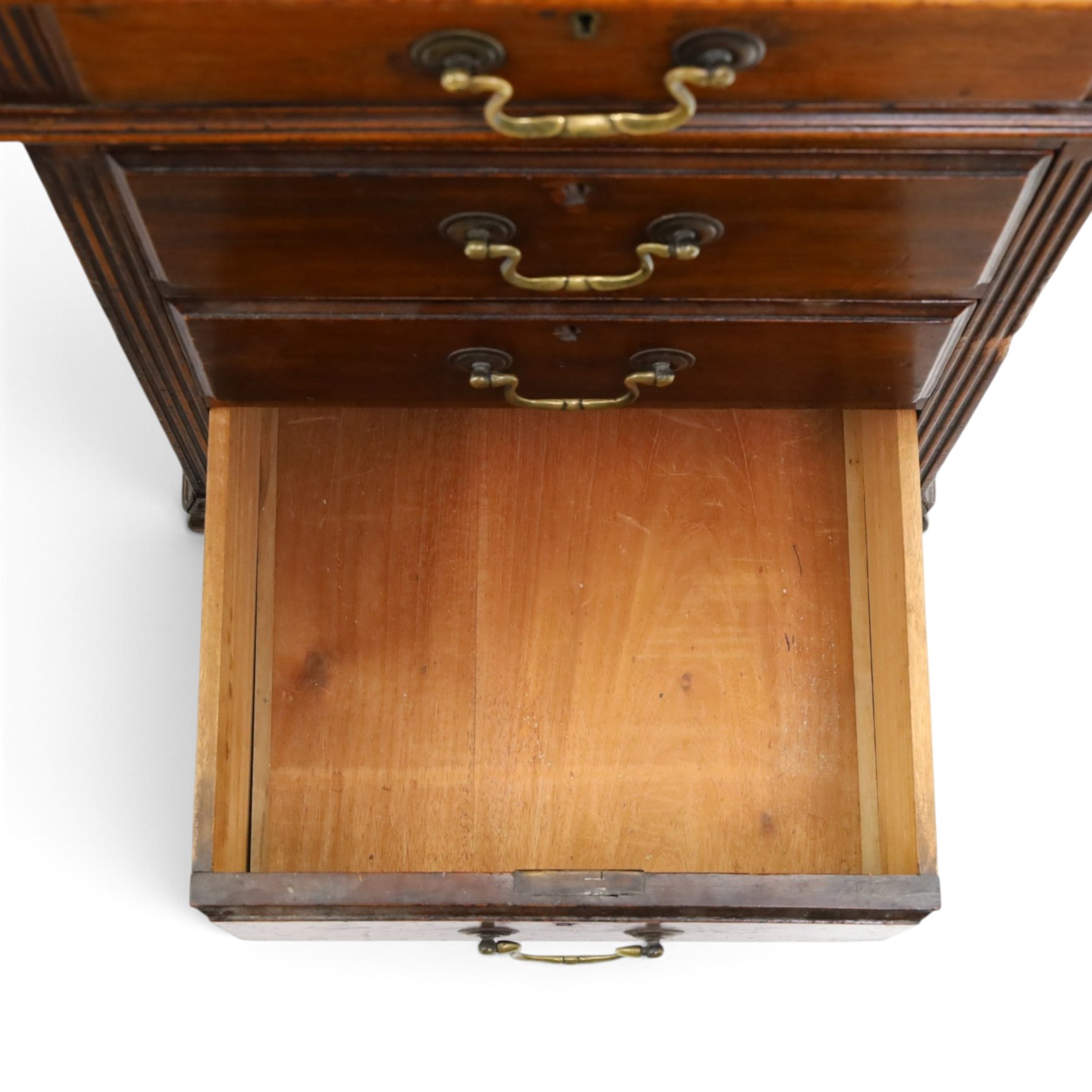 D Matthews & Son Office Furnishers (Liverpool) - Edwardian mahogany twin pedestal partners desk, rectangular top with inset green leather writing surface, fitted with an assortment of twelve drawers with brass swan neck handles, the pedestals with cupboards fitted to the opposing side, raised on ogee bracket feet