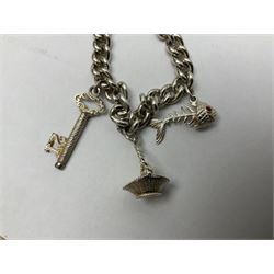 9ct gold diamond and sapphire cross pendant necklace, 9ct gold heart clasp and a silver charm bracelet 