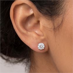 Pair of platinum diamond earrings, each stud set with a single round brilliant cit diamond, hallmarked, total diamond weight approx 1.50 carat