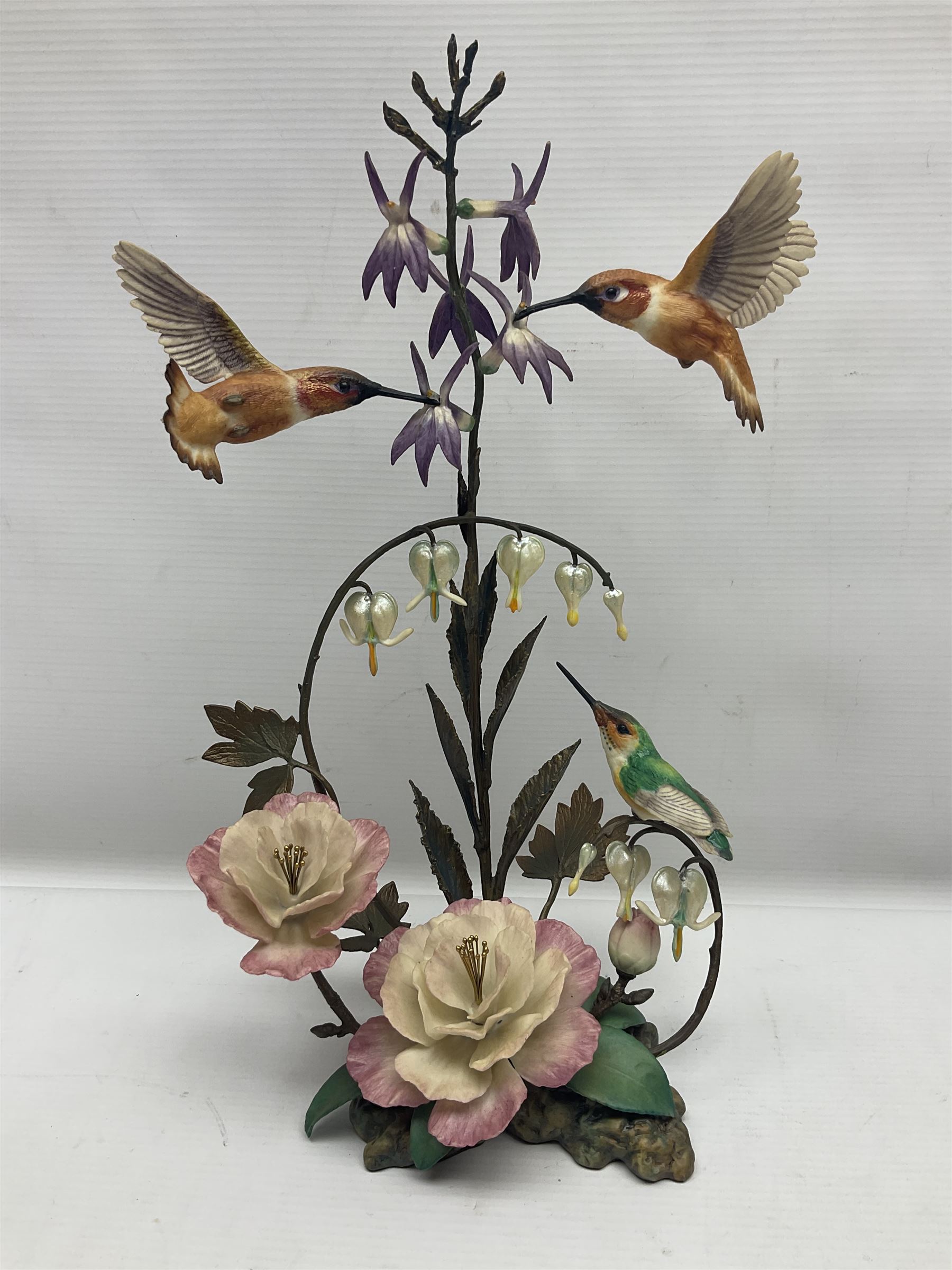 Franklin Mint House of Faberge, four humming bird figure groups, comprising Flight of Fancy, Beauty in Bloom, Splendor in the garden and The Enriched Garden, largest H35cm