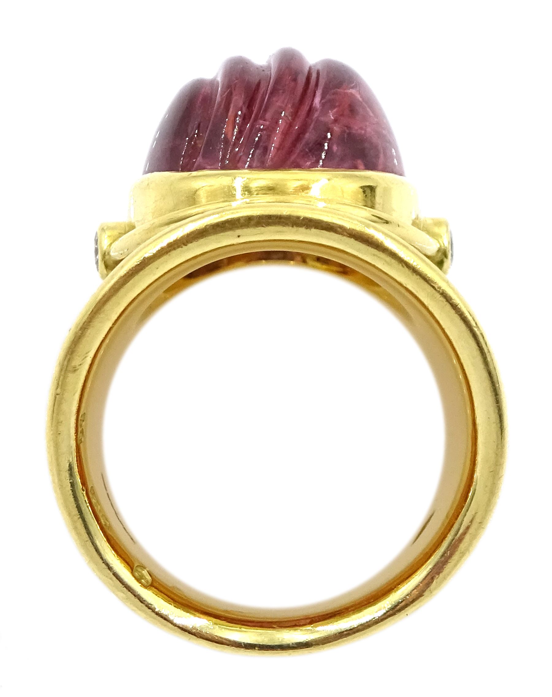 Elizabeth Gage 18ct gold tourmaline and diamond tapered Templar ring, the carved oval pink tourmaline cabochon with a round brilliant cut diamond set either side, the band featuring green guilloche enamel and the edges finished with wire-twist-wire decoration, London 1994, in original box
