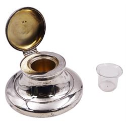 1920's silver mounted capstan inkwell, of typical plain form, the hinged cover lifting to reveal a gilt interior and removable clear glass inkwell, hallmarked Mappin & Webb Ltd, Birmingham 1928, H5cm base D10cm