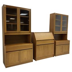Sutcliffe of Todmorden - pair of teak wall units, fitted with two glazed doors over drawer and double cupboard (W86cm, D45cm, H198cm); and a matching fall front bureau (W84cm, D41cm, H100cm)