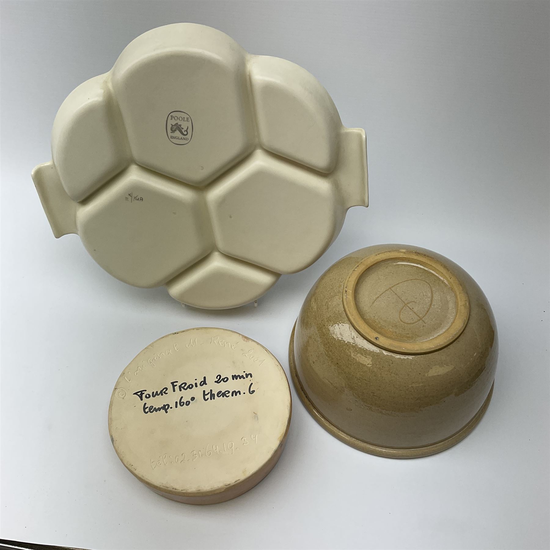 A Poole pottery hors d'oeuvres dish decorated with fish and shrimps in pastel colours D30.5cm, with a large studio pottery bowl with internal decoration D22cm and a studio pottery deep dish with orange and green decoration D7cm.