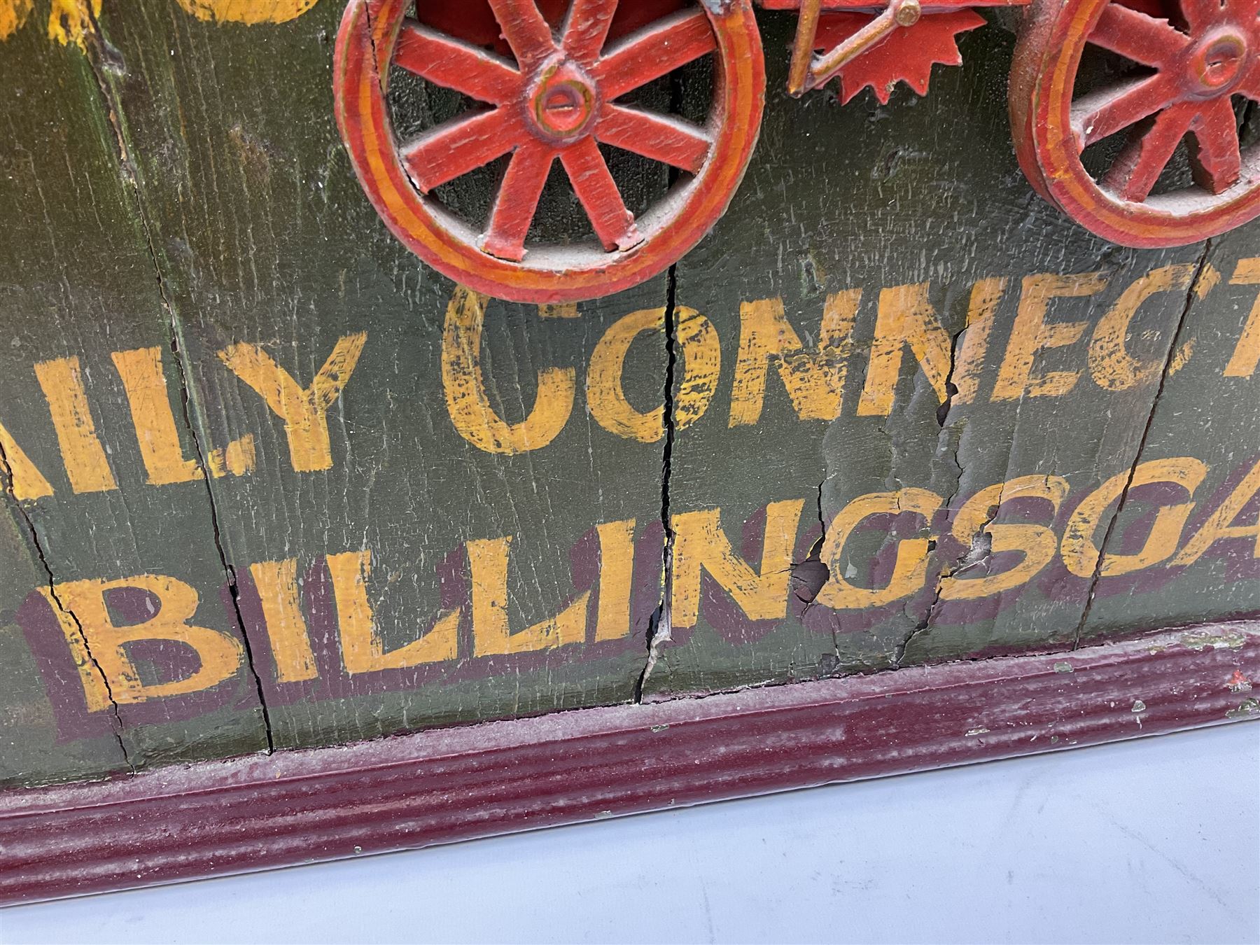 `The Grimsby-York Railroad Co.` painted wooden railway advertising sign 20th century, of planked construction with arched top and moulded border, decorated with an applied wood and metal image of an early steam locomotive in relief, the surrounding wording reading `The Grimsby-York Railroad Co., Fast Dispatch by Rail from Fish Curing Houses of Grimsby & Hull, Est. 1873, Daily Connections to Billingsgate`, 89 x 71cm
