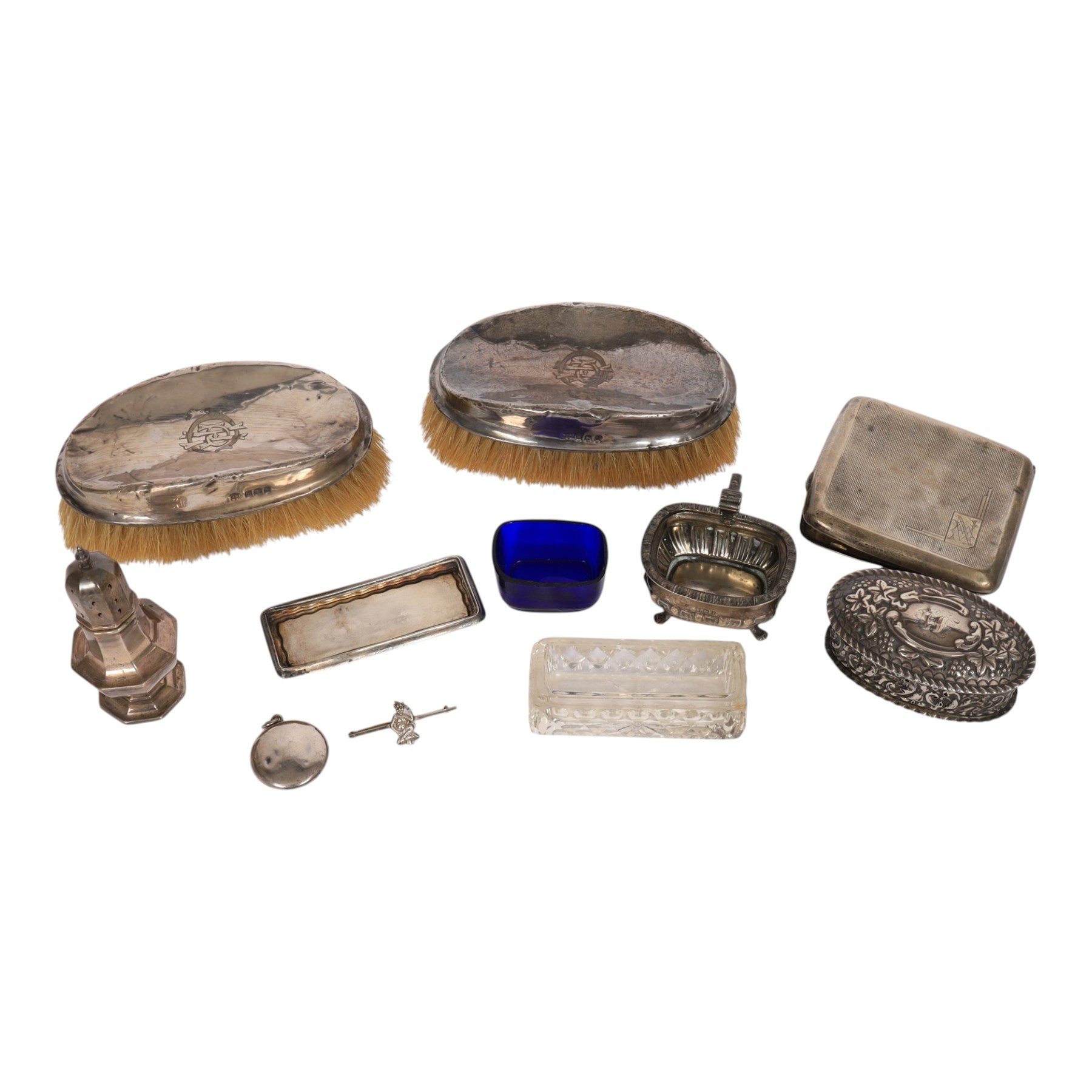 Collection of silver, including pair of silver mounted clothes brushes, cigarette case, mustard pot, pepper shaker, glass jar with silver lid and oval box
