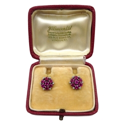 Pair of 9ct white gold ruby and diamond cluster stud earrings, retailed by J W Benson Ltd, London boxed