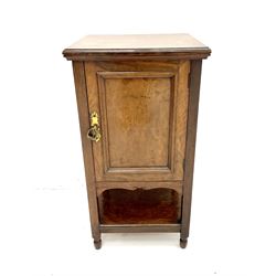 Edwardian oak bedside pot cupboard enclosed by panelled door, stile supports joined with with under tier 