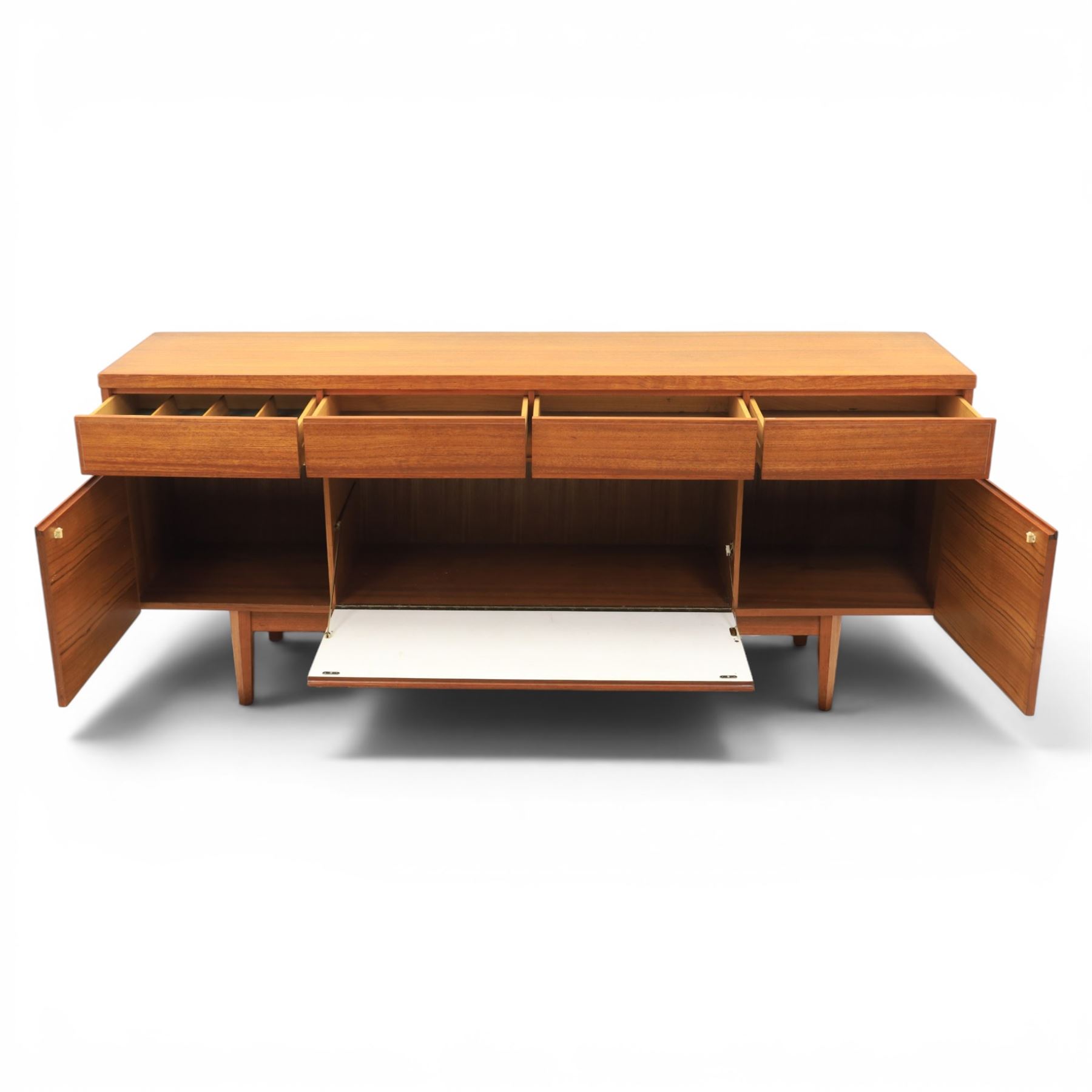 Mid-20th century teak sideboard, rectangular top above four frieze drawers with recessed handles, flanked by two cupboard doors with fall front central media cupboard