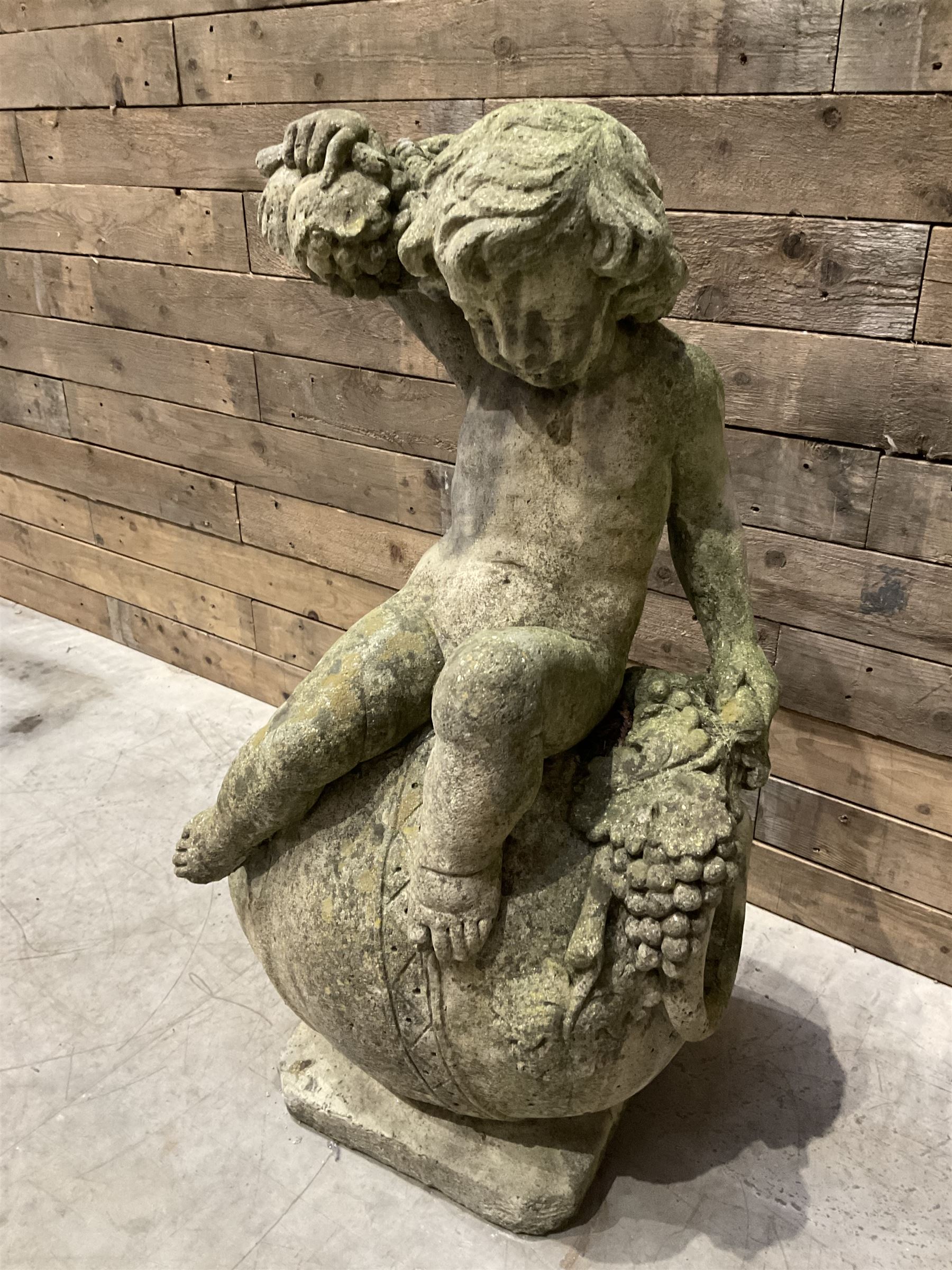 Cast stone garden figure - grape carrier on barrel