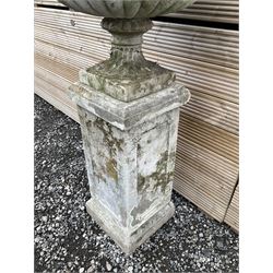 Cast stone urn on plinth, on tall square plinth - THIS LOT IS TO BE COLLECTED BY APPOINTMENT FROM DUGGLEBY STORAGE, GREAT HILL, EASTFIELD, SCARBOROUGH, YO11 3TX