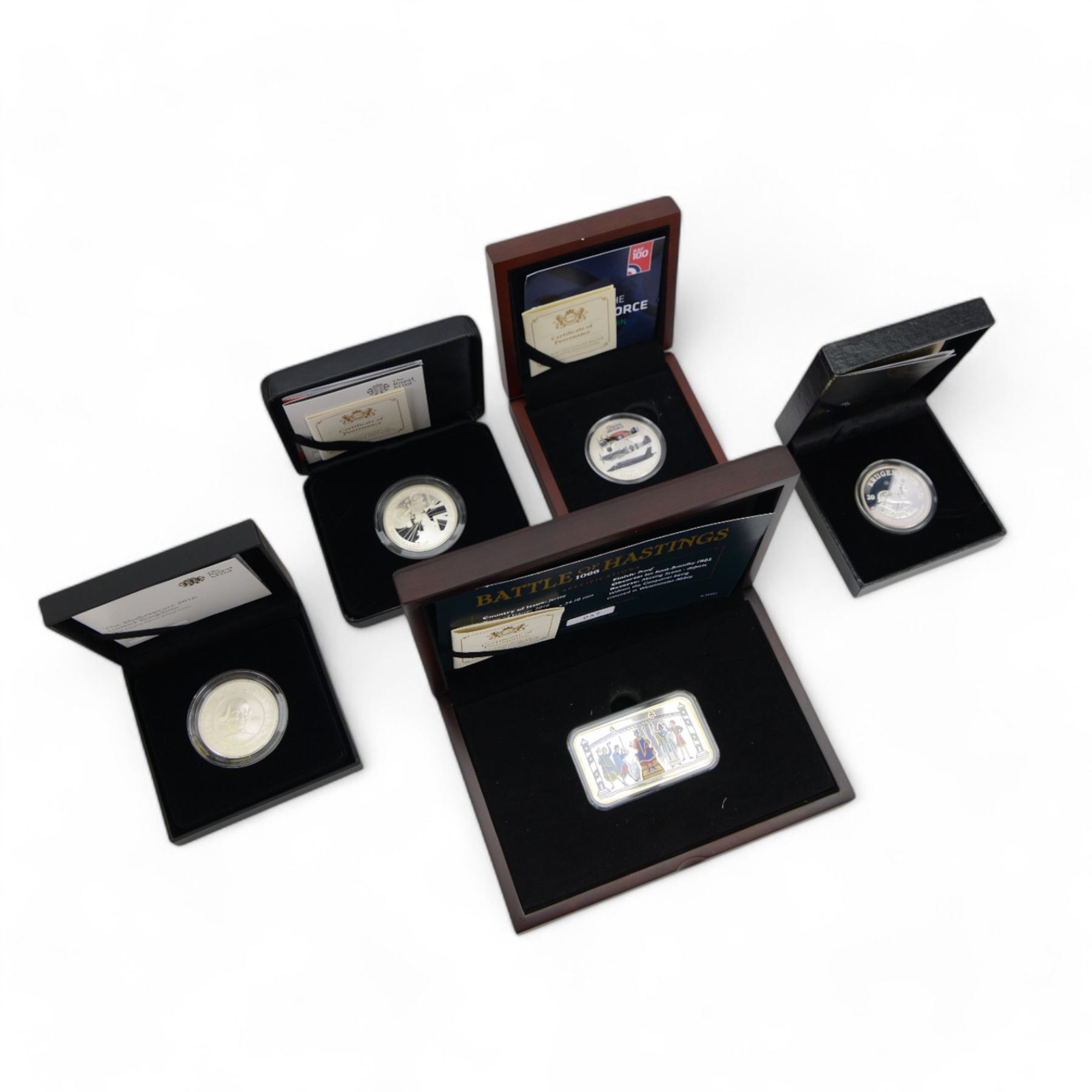 Five silver proof coins, comprising The Royal Mint United Kingdom 2016 'Shakespeare' one ounce two pounds, 2017 'Britannia' one ounce two pounds, Bailiwick of Jersey 2016 'Battle of Hastings' ten pounds coin bar, 2018 '100 Years of the Royal Air Force' five pounds and South Africa 'Krugerrand' one ounce, all cased with certificates