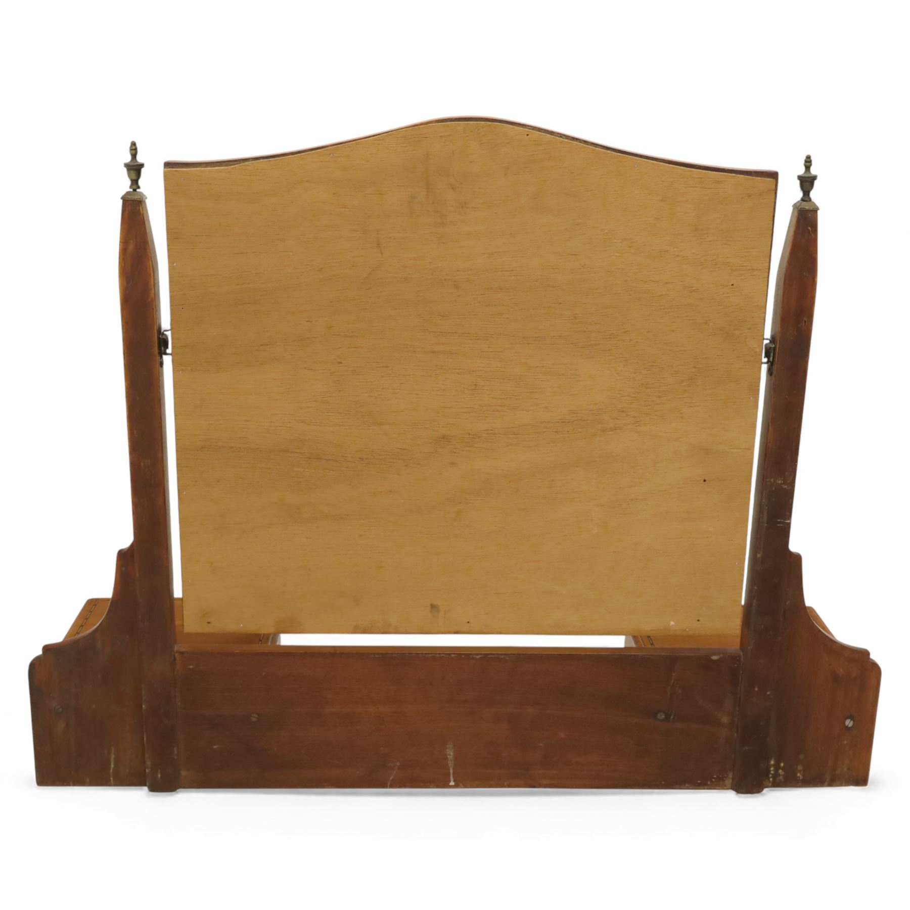 Two early 20th century mahogany swing dressing mirrors, comprising one with arched rectangular plate in a moulded frame on shaped supports, flanked by two inlaid trinket drawers (H 69cm, W 88cm, D 20cm), together with another rectangular plate mirror on turned supports upon bun feet (H 58cm, W 48cm, D 23cm)