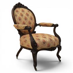 Victorian mahogany open armchair, oval stuff-over back with floral upholstery, moulded and...