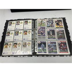 Hull F.C. memorabilia; Clive Sullivan 1986 memorial game programme, Open Evening 1994 programme with multiple player signatures, 'Old Faithful' 45rpm record, Wembley rosettes, 2000 team poster with facsimile signatures, framed print 'Farewell to the Boulevard 1895-2002', fully signed team photograph, various booklets, CD, DVD etc; and a folder containing the Merlin Rugby League card collection