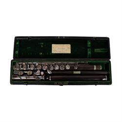 Early 20th century rosewood clarinet by Geo. Potter & Co Aldershot, together with a flute in fitted case, the lid with label reading Edward Potter