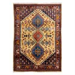 South Persian Yallameh hand-knotted rug, ivory ground, with a central stepped pole medalli...