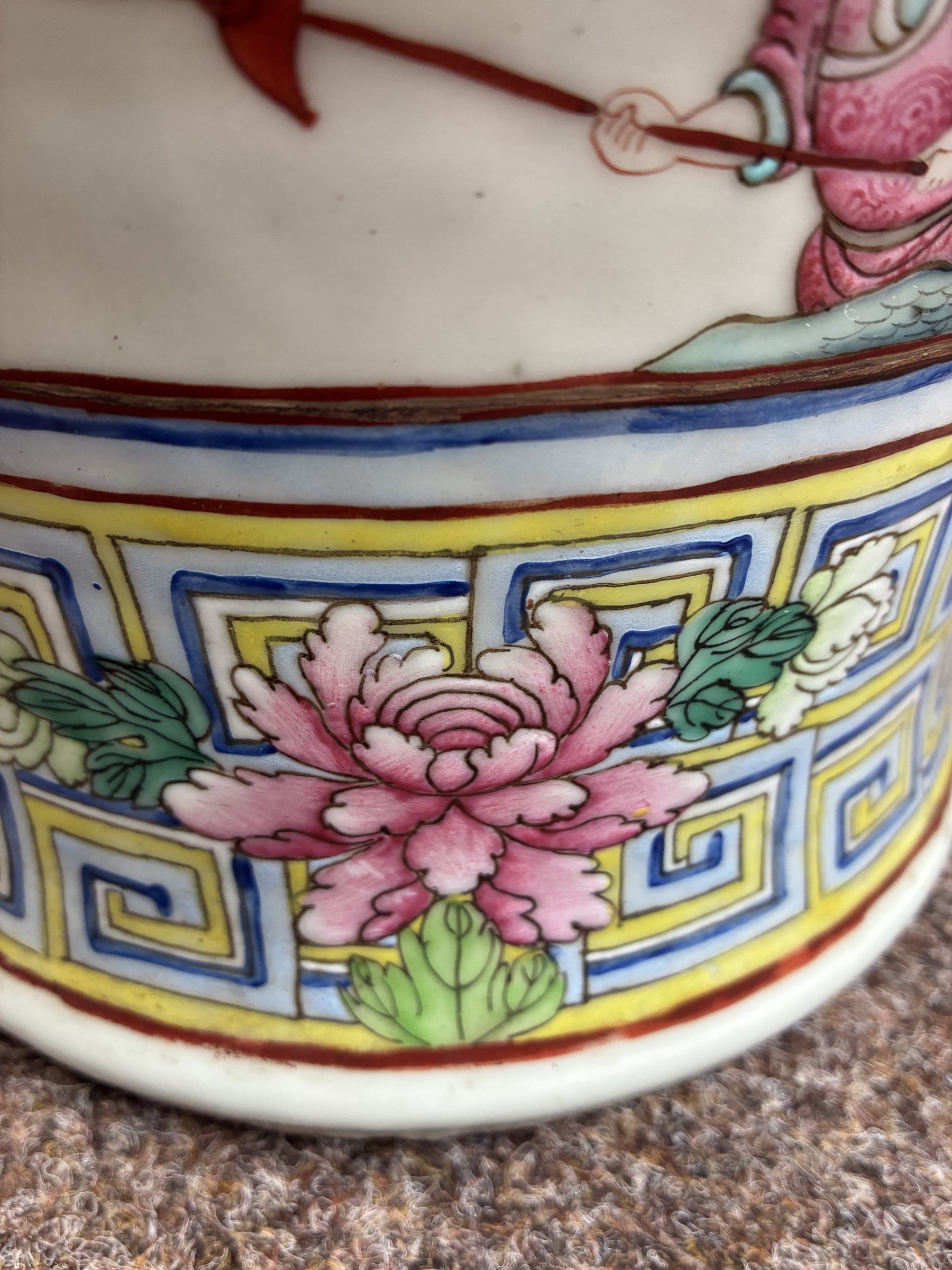 Large pair of 19th century Cantonese famille rose vases, each painted with various courtly scenes, including a display of warriors fighting on horseback before an official and his attendants, double Buddhist lion handles and applied at the shoulders with chilong, the lower band painted with Greek key motif, H58cm (2)