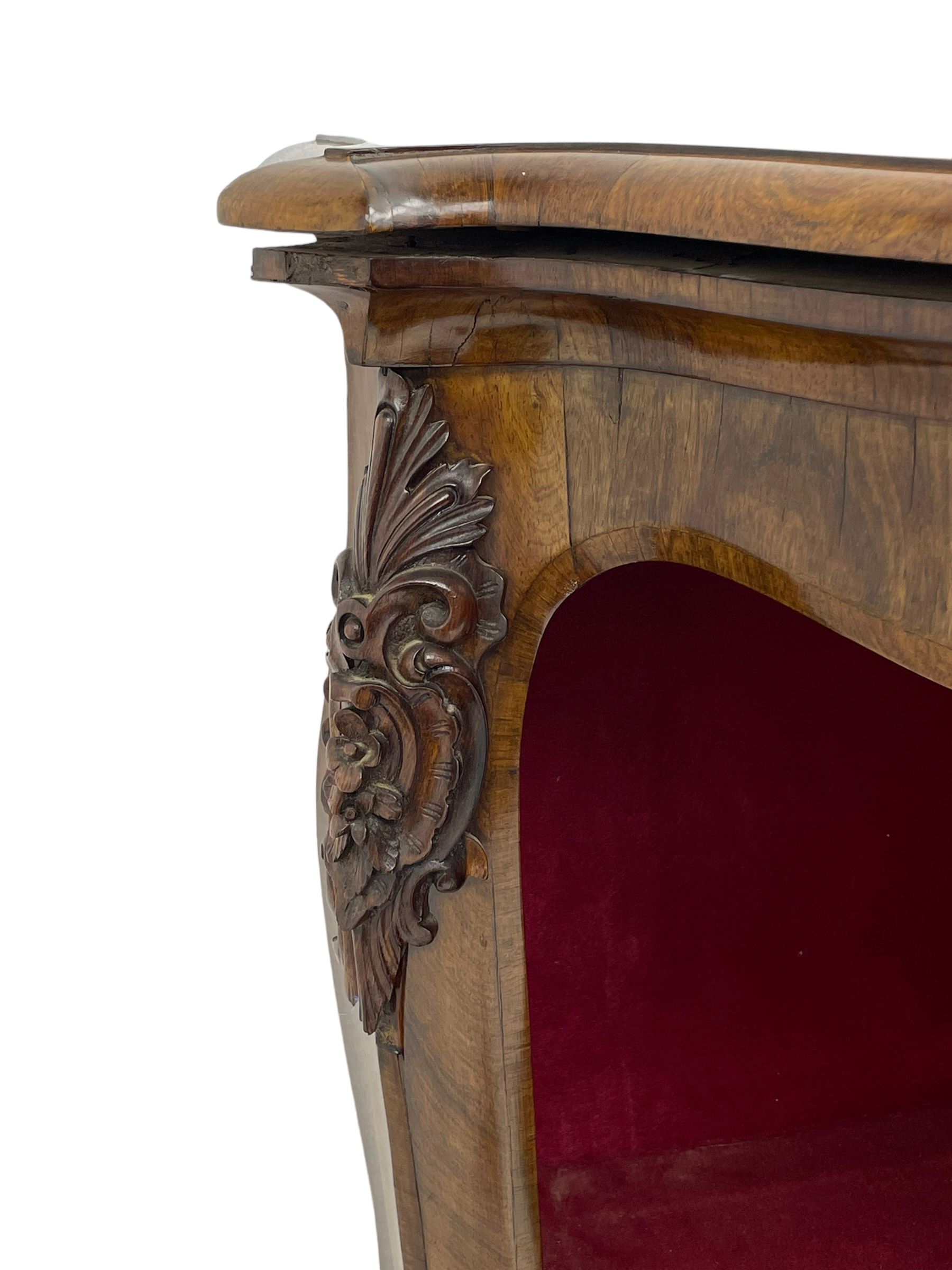 19th century rosewood buffet credenza, bombe form with shaped and moulded top, two central glazed doors with foliate moulded gilt slips, the red fabric-lined interior fitted with a single shelf, flanked by open shelves with raised gilt metal lips, the uprights decorated with shell and flower head carved cartouche mounts, acanthus leaf scroll carved lower mounts, on shaped and moulded plinth base 