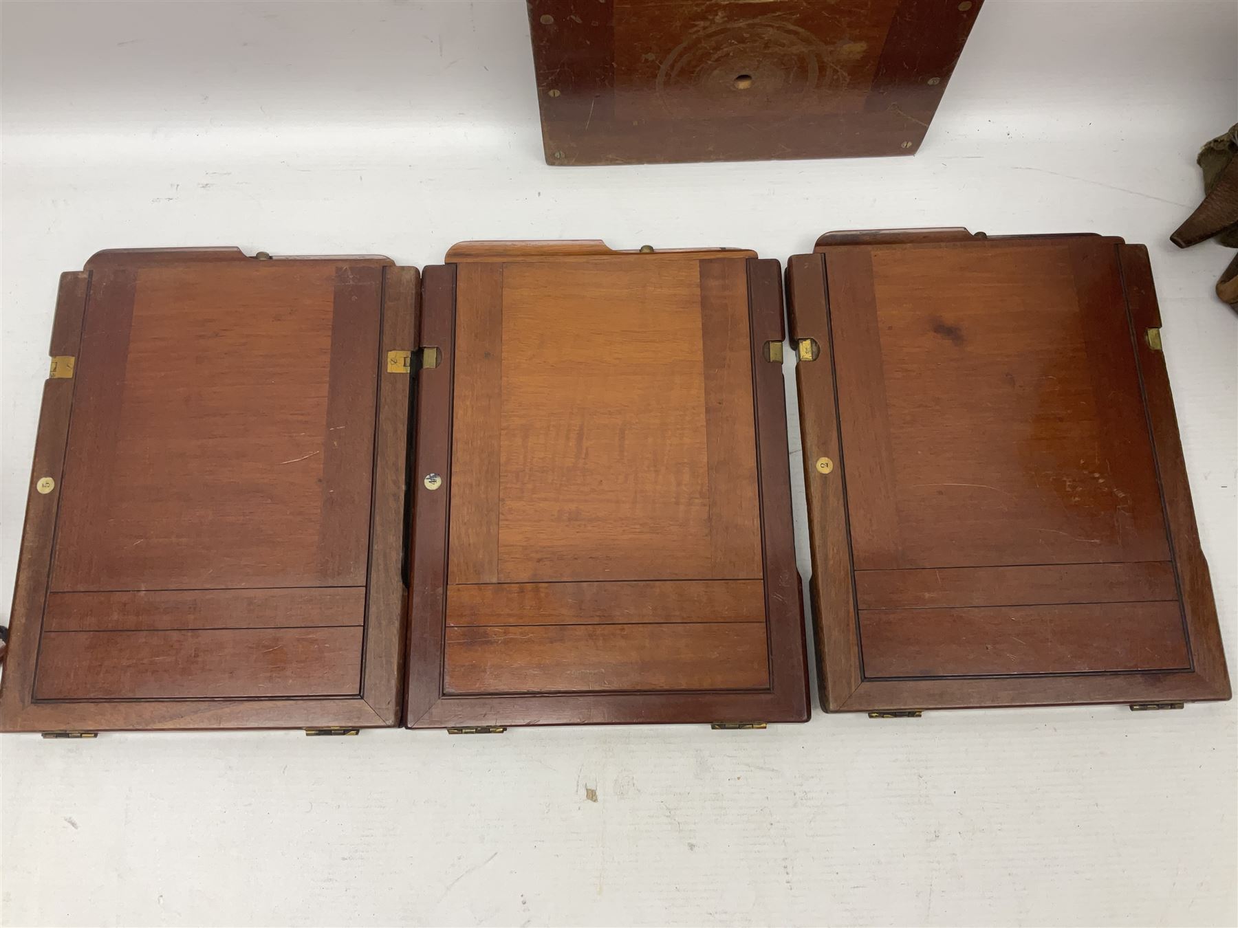 Collation of folding plate cameras of various sizes folding plate in mahogany and lacquered brass, together with camera plates and slides
By vendors repute some slide are from the Gandolfi workshop