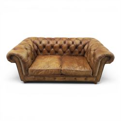 HALO - Chesterfield style two seat sofa upholstered in buttoned brown leather with stud work, on turned feet with castors