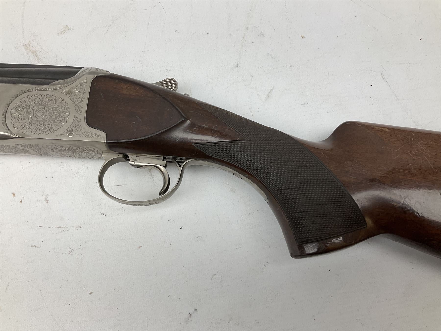 Winchester Japan 5500 12-bore by two-and-three quarters over-and-under double barrel boxlock ejector sporting gun, with 71cm barrels, ventilated rib and barrels, the walnut stock with chequered pistol grip and fore-end, single selective trigger and top safety, serial no.K542927E, L115cm overall; in gun sling SHOTGUN CERTIFICATE REQUIRED