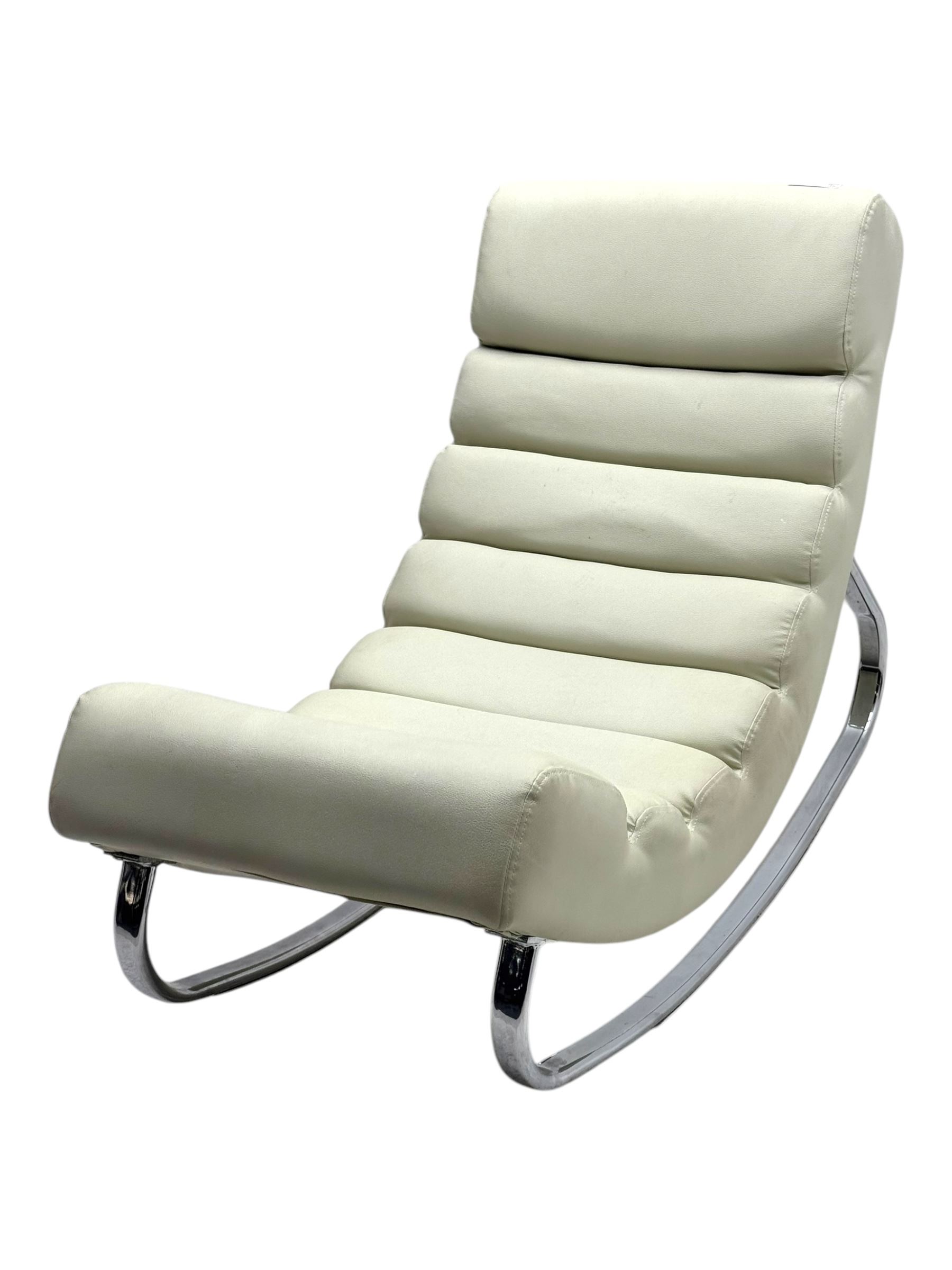 Cream leather modernist rocking chair, leather upholstery with horizontal channel stitching, supported by a chrome-plated tubular frame 
