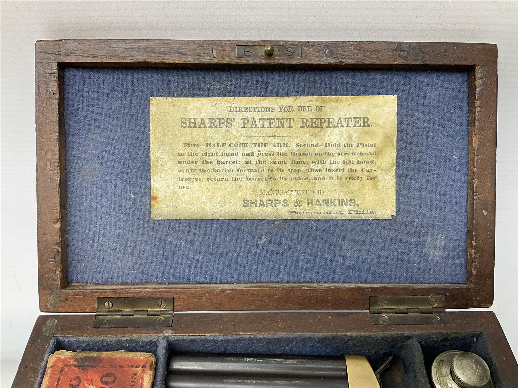 Mid-19th century Sharps' Patent Repeater four-barrelled Deringer pistol, dated 1859, approximately .30 calibre rim fire, brass bodied with rotating firing pin, serial no.8767, L16cm; in fitted rosewood box with label under lid, rack of ten deactivated cartridges, oil bottle and screwdriver and owner's name in brass cartouche to lid.