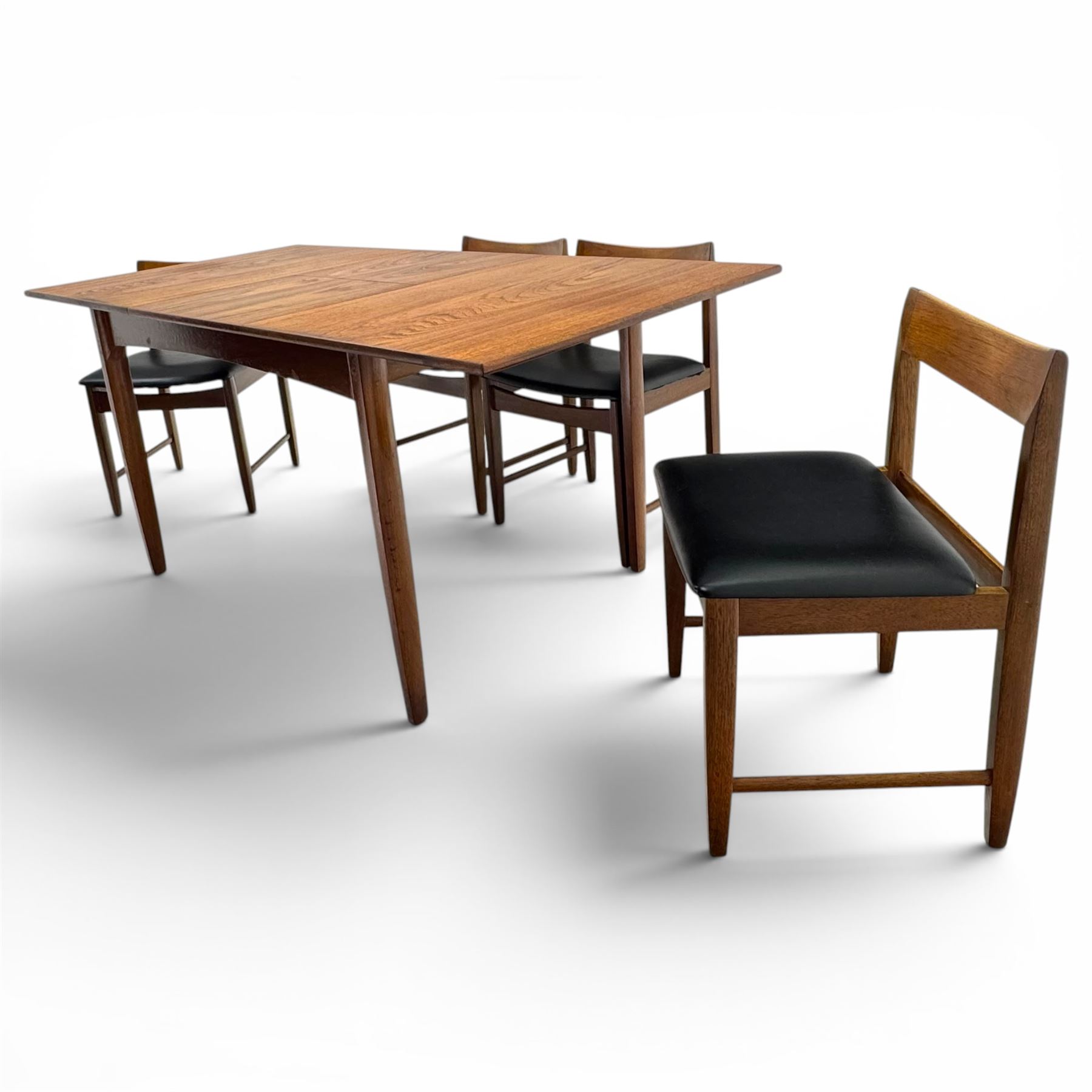 BCM (Bath Cabinet Makers) - mid-20th century teak extending dining table with BCM set of four teak dining chairs with bar back and black vinyl seats