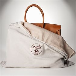 Hermès - gold hardware 'Birkin 35' handbag in gold Togo leather with white stitching, featuring gold-plated hardware, double rolled handles, front flap, belted turn-lock closure, and leather lining with one zip and one slip pocket, stamped 'Hermes Paris Made in France' in gold, with blind-stamp Q (2013) with craftsman’s code 70A to the underside of locking belt. Accompanied by: padlock, keys, clochette, Hermes dust bag, booklet, and ribbon. New unused condition.