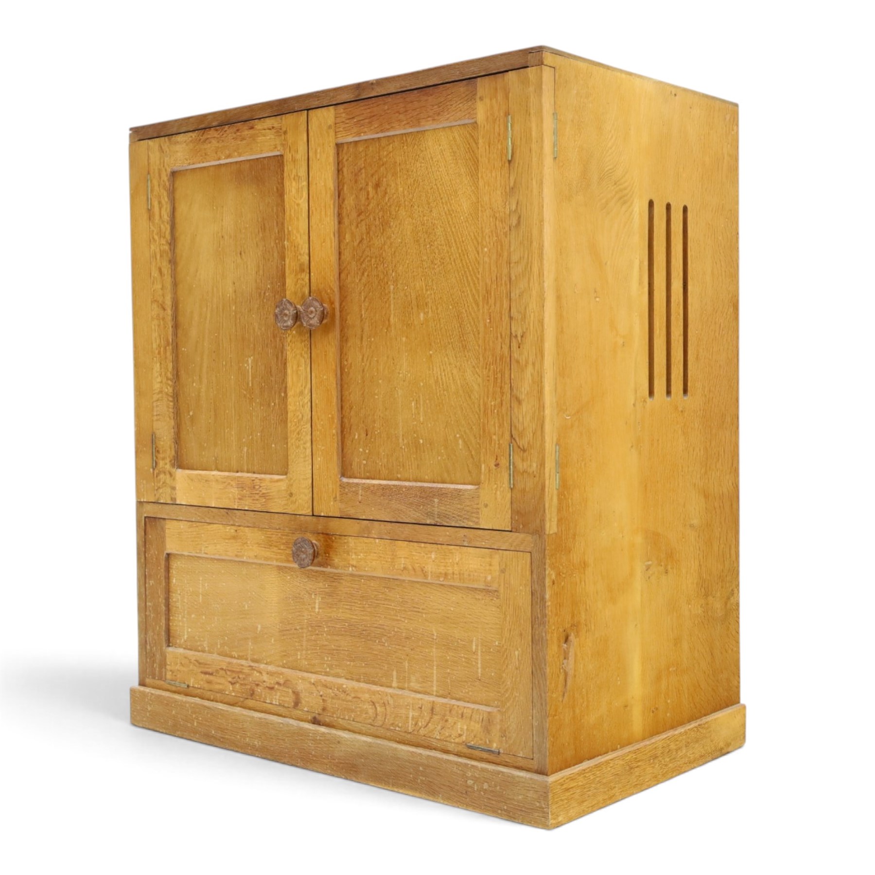 Lizardman - adzed oak media cabinet, adzed rectangular top above twin doors enclosing a shelved interior, above a fall front drawer, Yorkshire Rose carved handles, raised on castors, with carved lizard signature, by Derek Slater of Crayke  