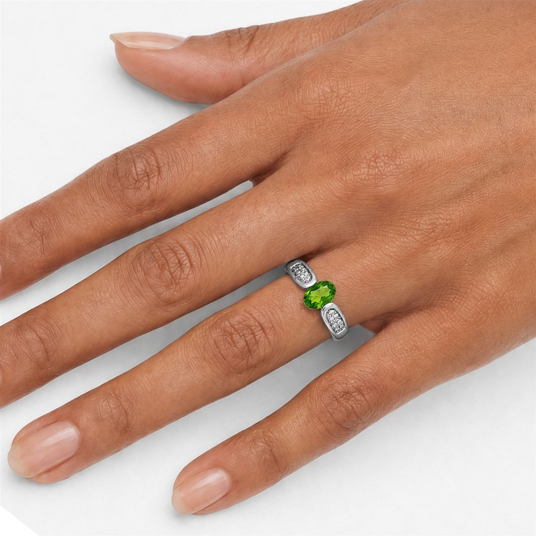 9ct white gold tsavorite garnet and diamond ring, single oval cut garnet with pave set diamond shoulders, Birmingham 2008